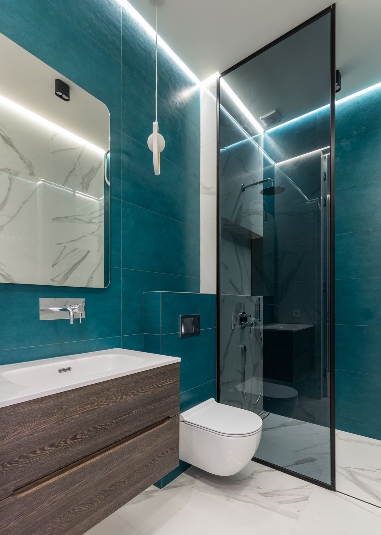 Remodeled bathroom with teal accents
