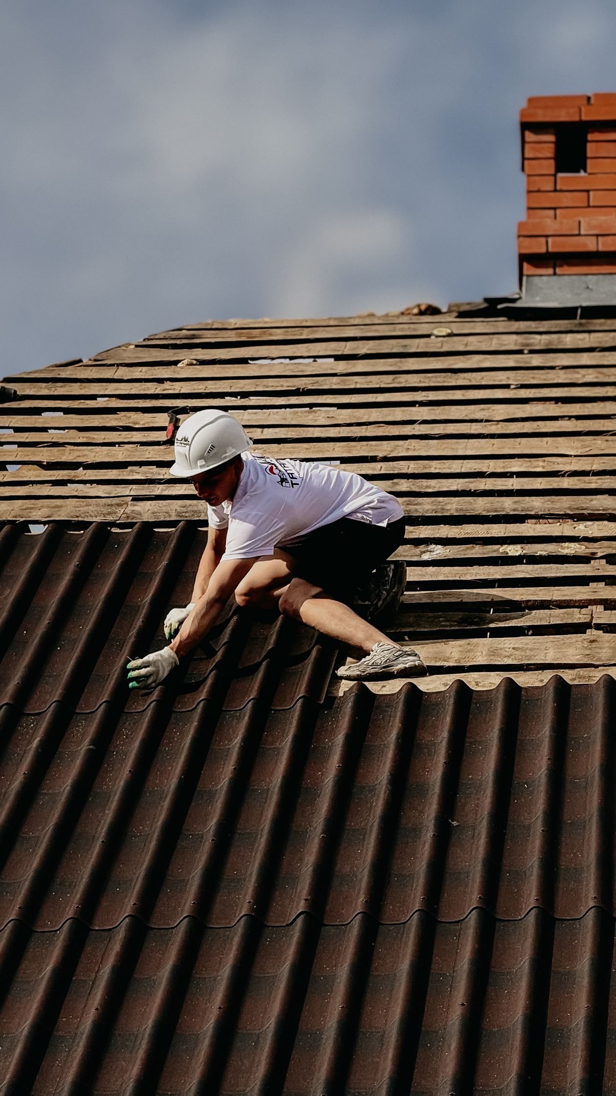 Roofing professional at work on a roof